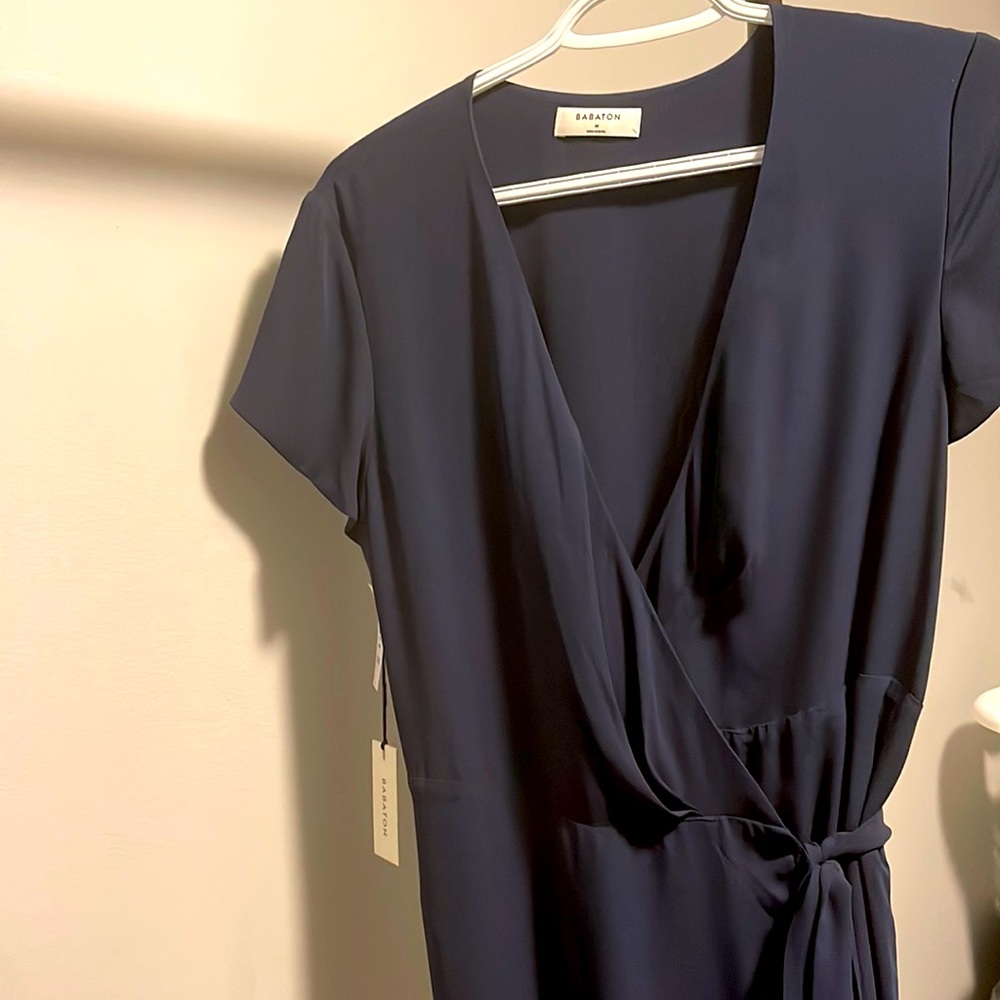 A wrap dress by Babaton available in Size M in colour Navy Blue